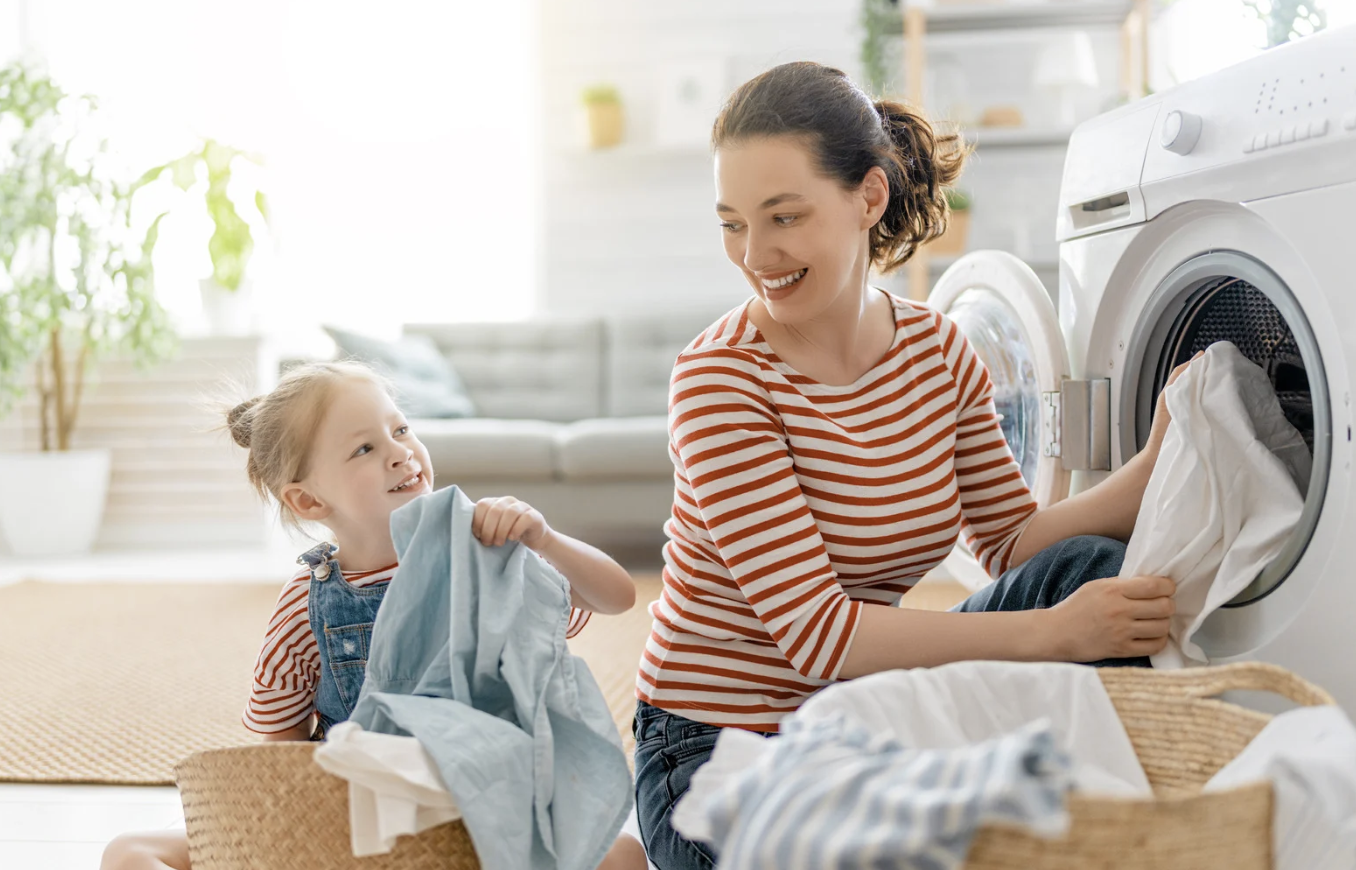 mother and daughter doing laundry together